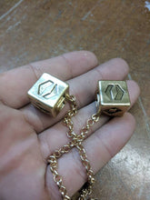 Load image into Gallery viewer, Antiqued Budget Metal Smuggler's Golden Dice - Scoundrel Gambler Rogue - Gold Plated Metal Dice - Hang in your cockpit -Zinc Alloy